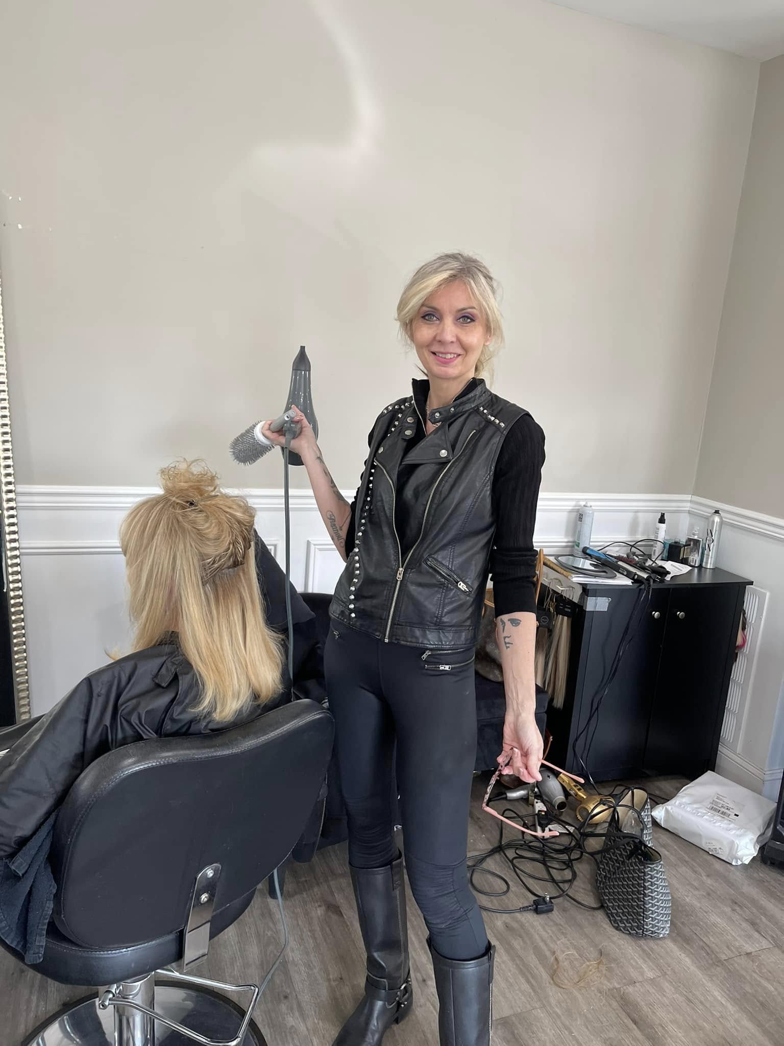 Stylist working with a client at New Synergy Salon